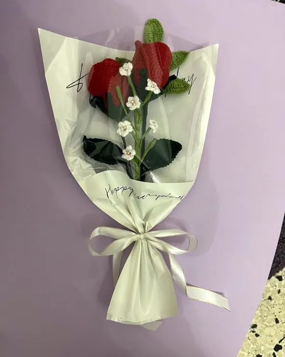 A bouquet of crocheted red roses