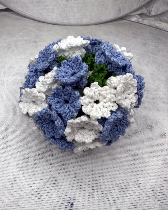 A crocheted dome in blue and white